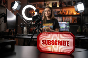 Lighted sign with 'SUBSCRIBE' text on a dark background