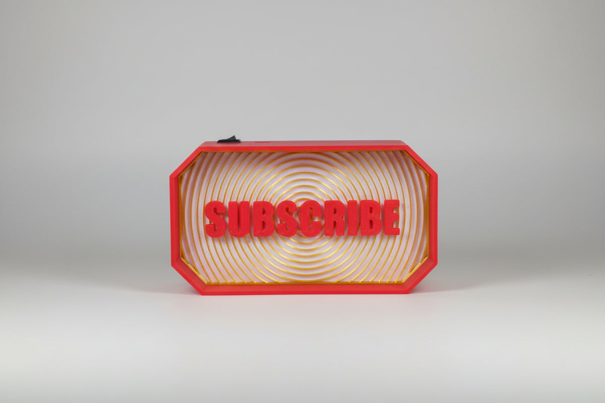 3D-printed sign with 'SUBSCRIBE' text in a red frame