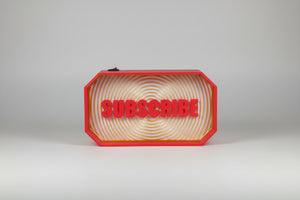 3D-printed sign with 'SUBSCRIBE' text in a red frame