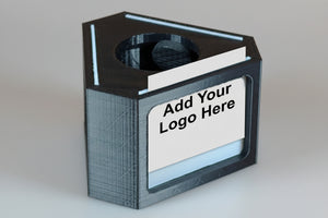 Black rectangular product with a white label on an white background