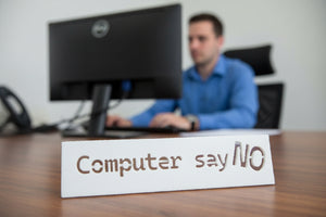 computer say no sign on an it desk
